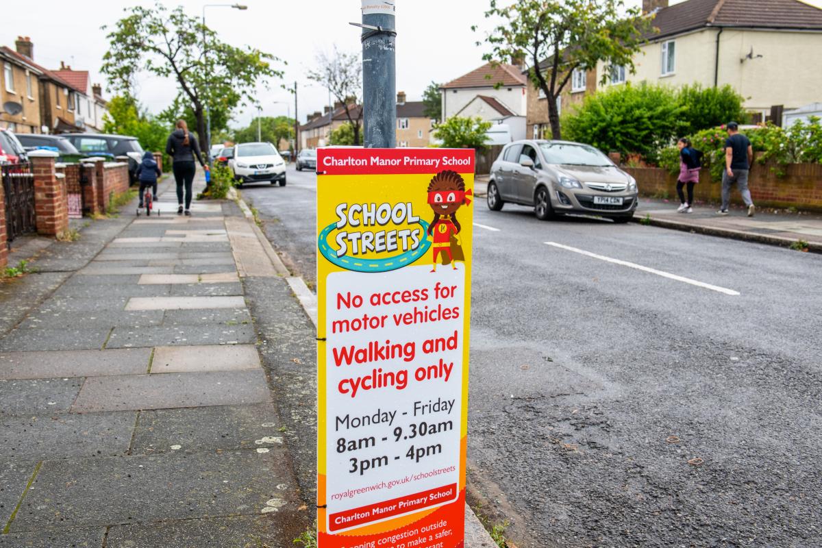 A bollard wrap advertising the School Streets scheme.