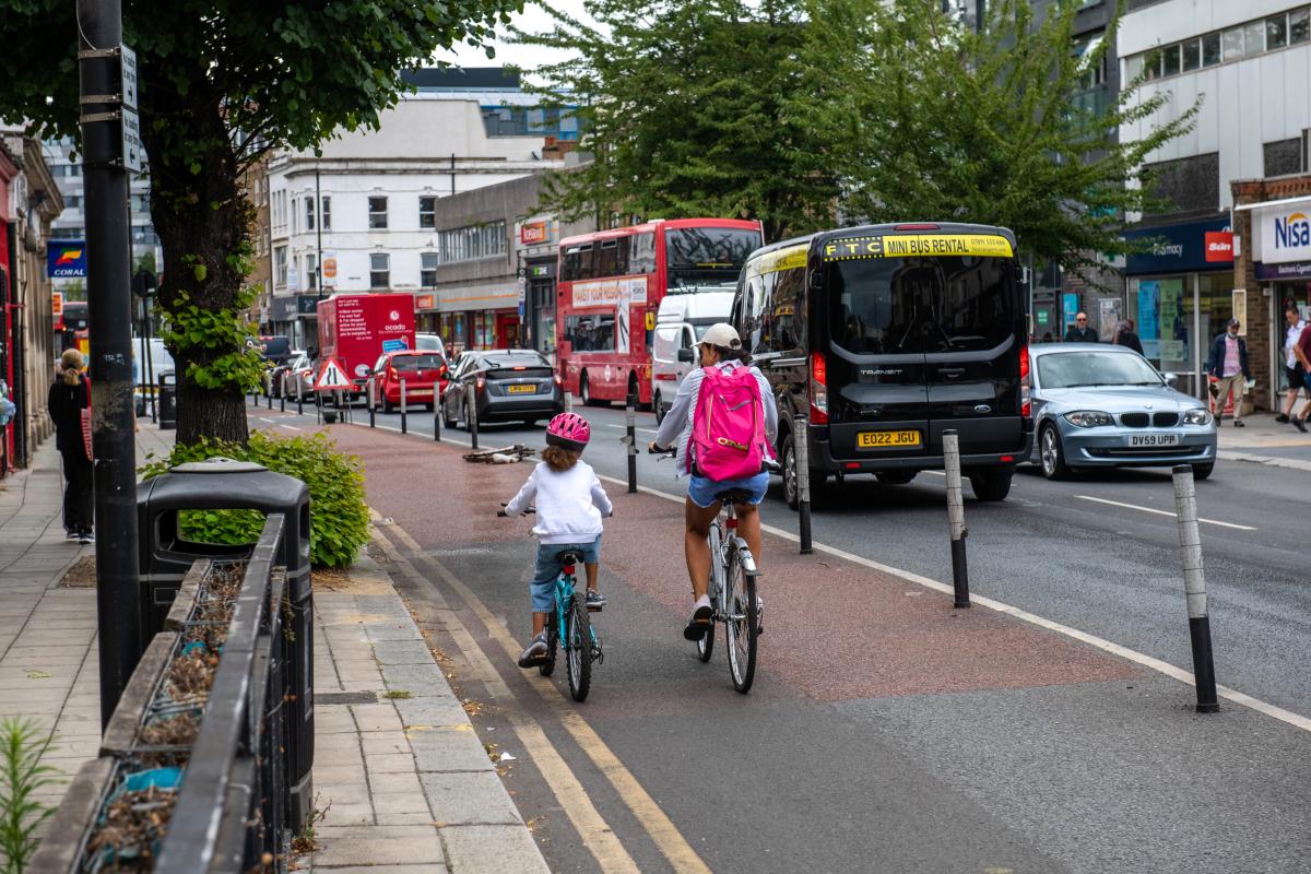 Adult and Child cycling along cycle route