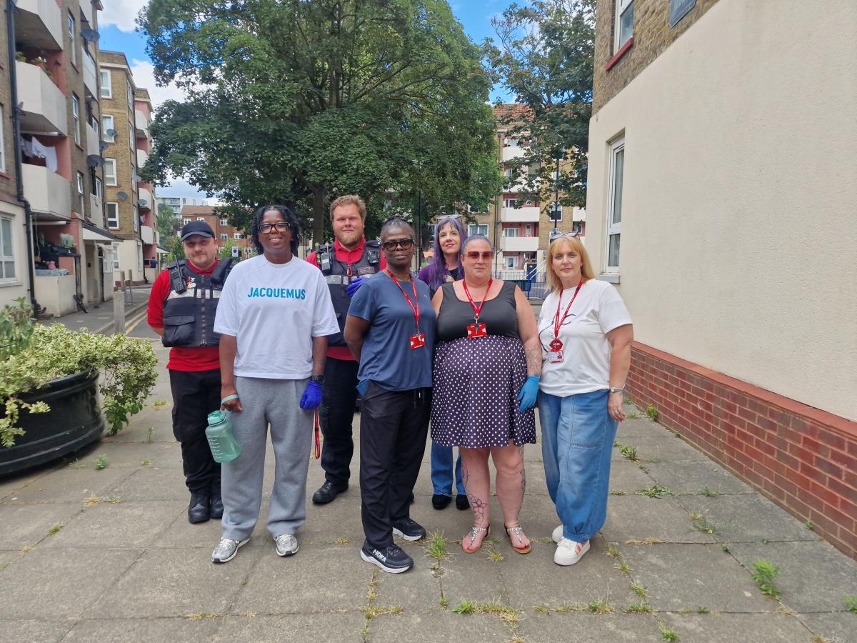 Seven council officers stand on an estate.