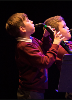 boy playing instrument