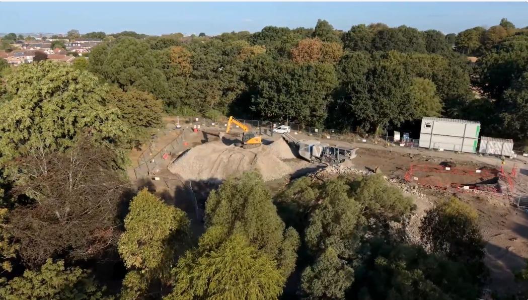 image of building site surrounded by trees