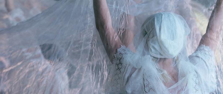 The back of a person dressed all in white