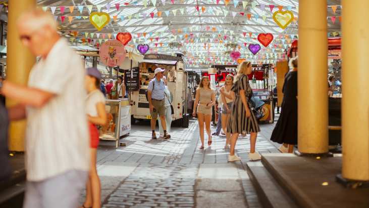 People walking around Greenwich Market