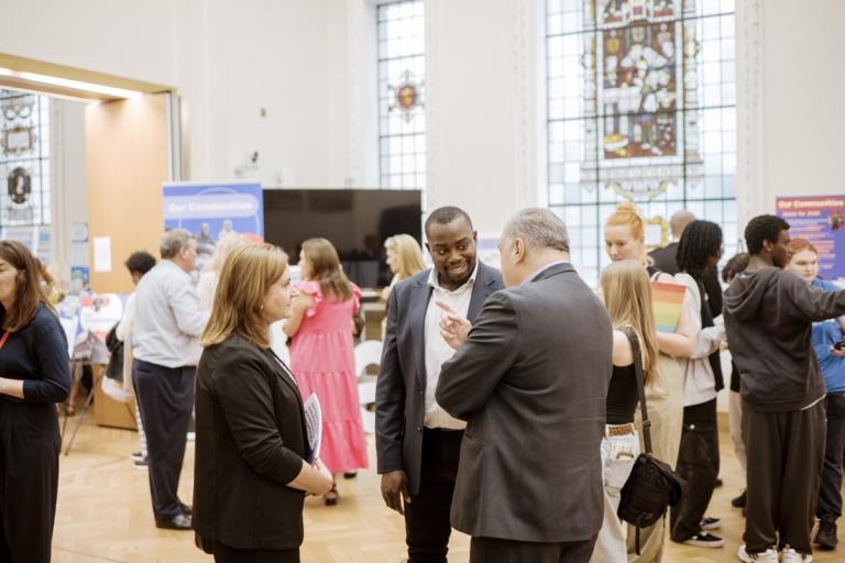A photo of the Leader Anthony Okereke speaking to people at the Our Greenwich event.