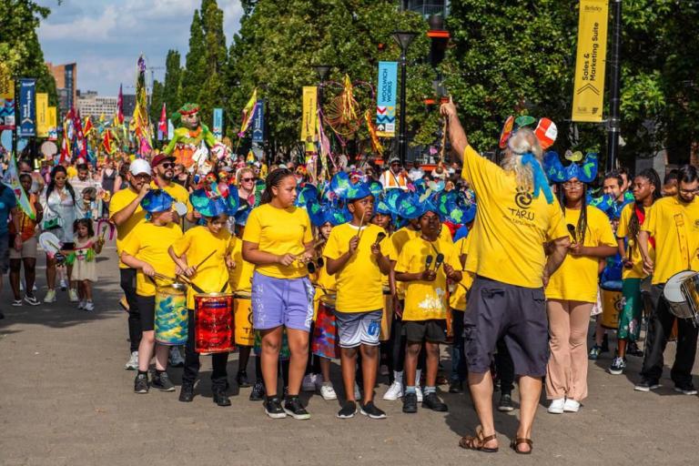 A photo of a crowd of children in a parade
