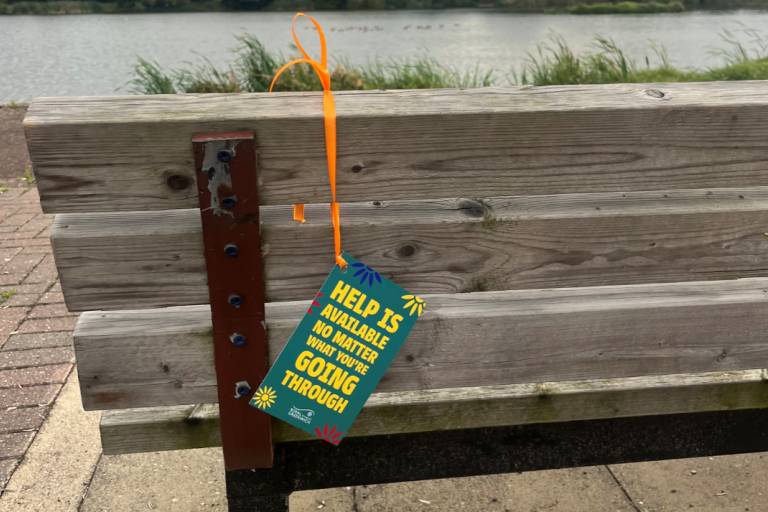 Suicide prevention tag on bench