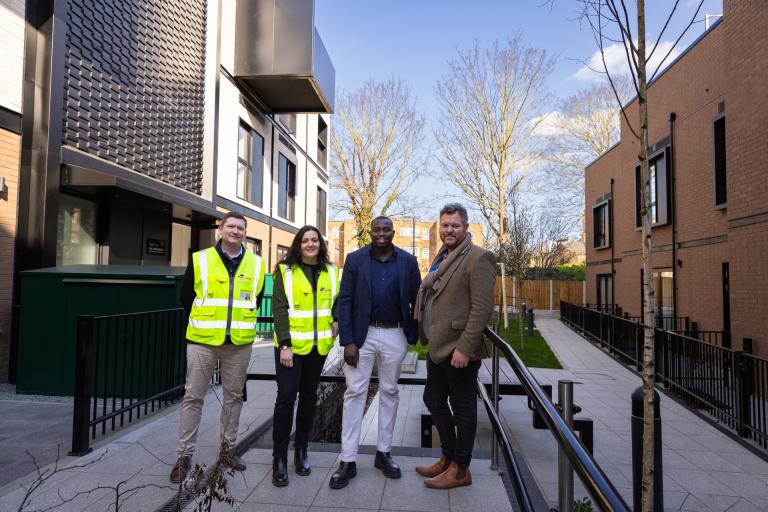 Councillor Anthony Okereke stood with Elkin Construction team working on Tusker Street council homes