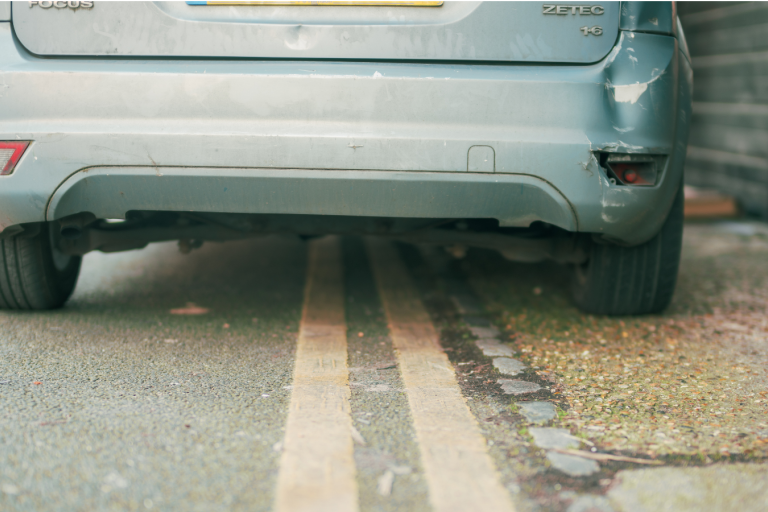 car parked by double yellow line