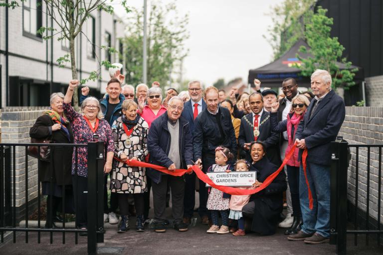 Photo of Councillor Grice's family, Mayor of Greenwich Cllr Jit Ranabhat, Leader of the Council Cllr Anthony Okereke, MP Clive Efford and councillors past and present cutting a ribbon to open Christine Grice Gardens