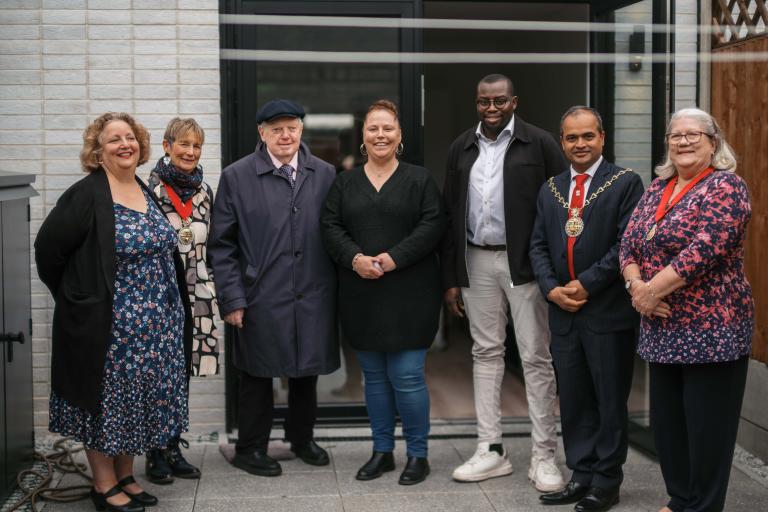 Photo of tenant Becca with Leader of the Council Cllr Anthony Okereke, Mayor of Greenwich Cllr Jit Ranabhat and ward councillors past and present 