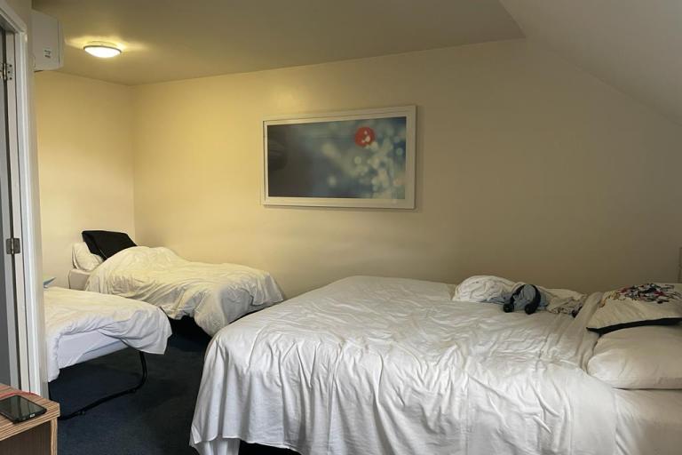 two empty beds in a room