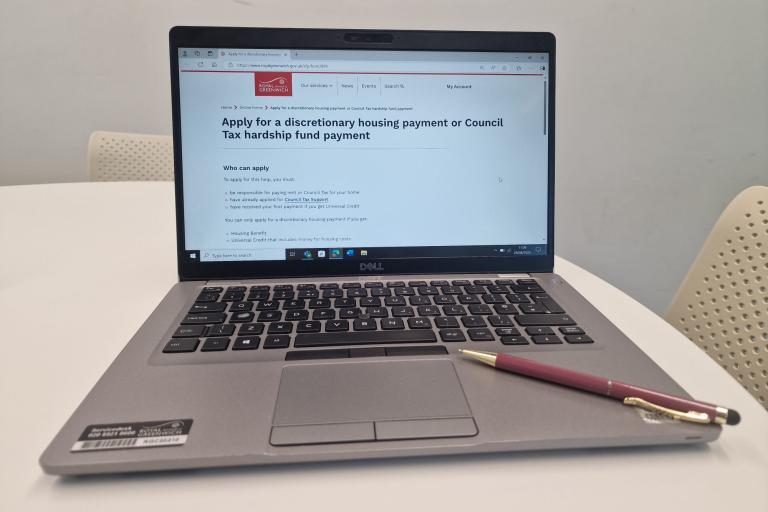 Laptop open showing the application for Council Tax Support