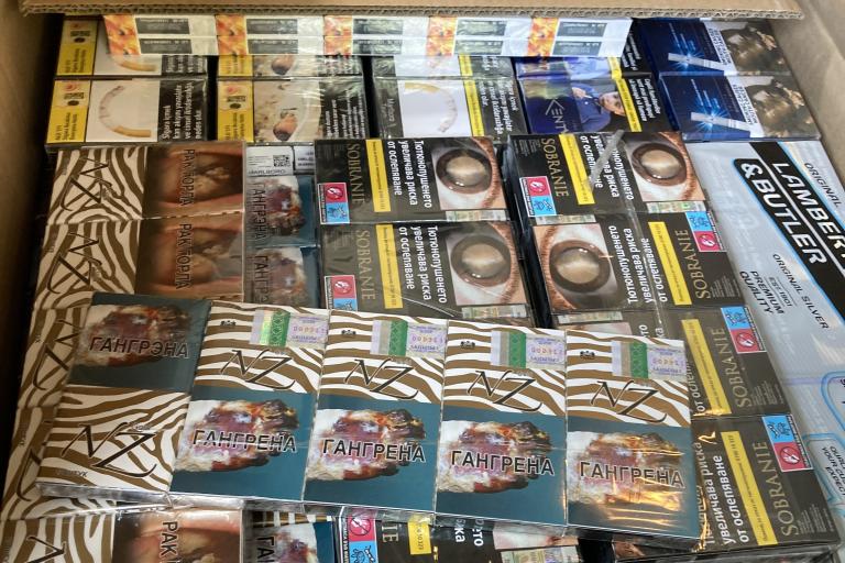 A box full of packets of seized cigarettes 