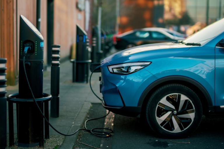 An image of an electric vehicle being charged
