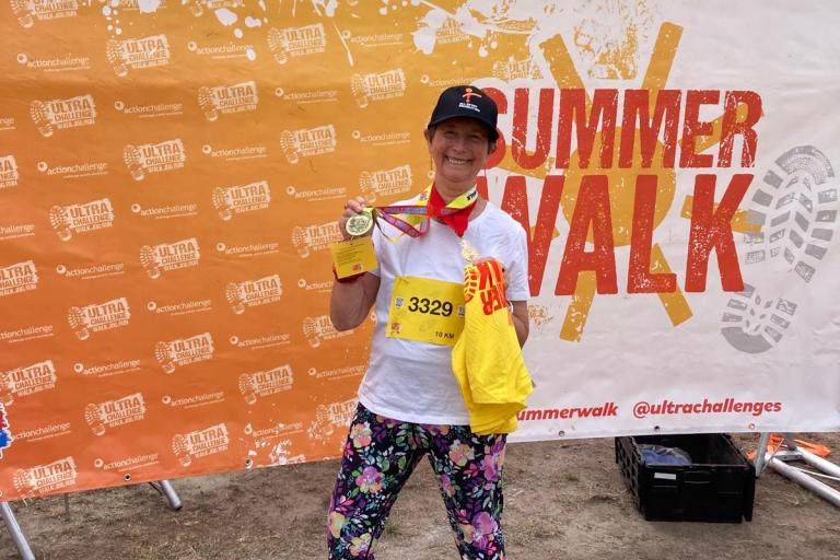 Mayor Cllr Linda Bird holding her medal after finishing London Summer Walk 10K
