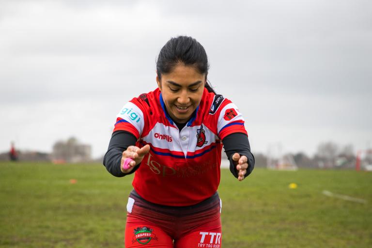 Woman doing a warm up before a rugby game