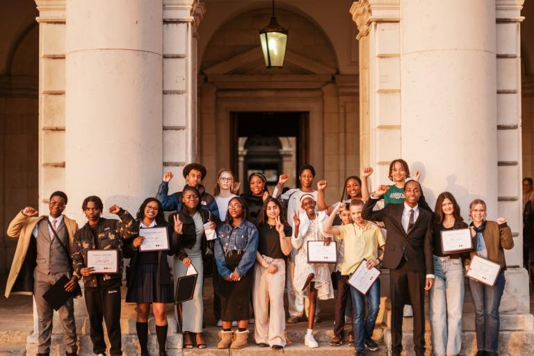 The 2025 to 2027 Greenwich Young People's Council standing together outside the Old Royal Naval College.