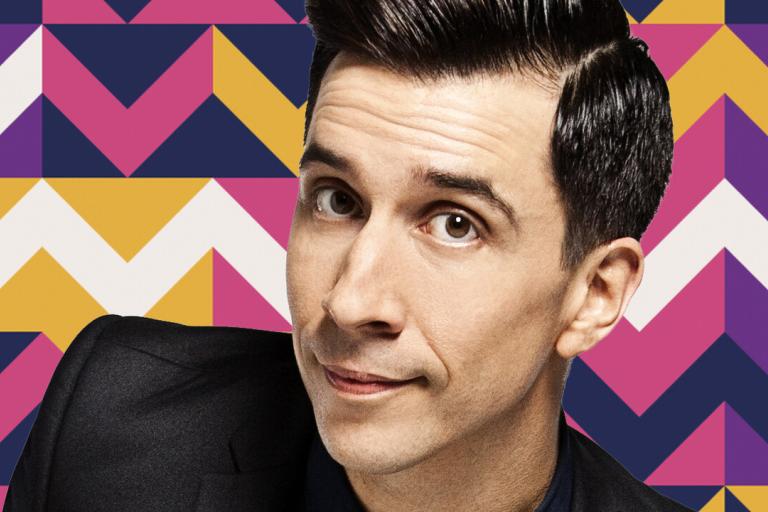 A man with short black hair looking at the camera (comedian Russell Kane)