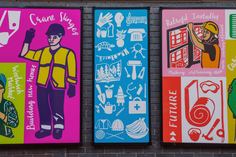 Colorful mural on Calderwood Street, Woolwich, called " work past, present, and future" showing  figures of workers, tools, and community symbols, created by artist Ellen Strachan with local residents.