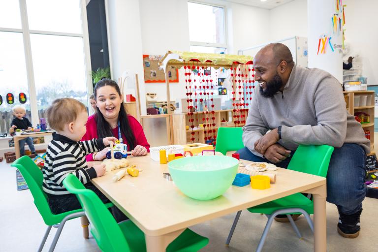 A member of staff and child at More2Kidbrooke nursery with Cllr Adel Khaireh