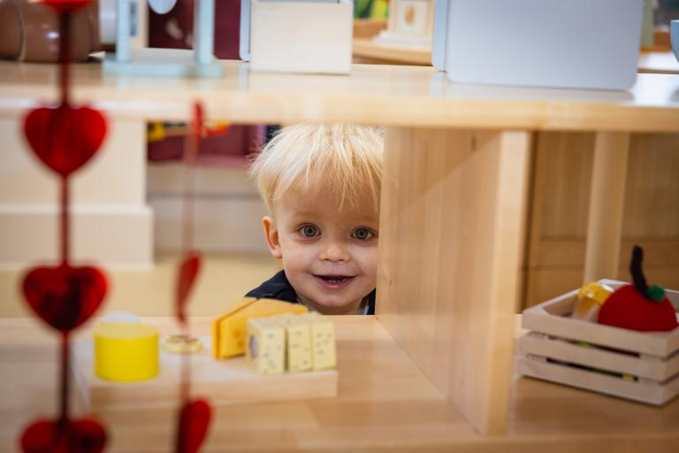 A photograph of a child playing at More2Kidbrooke Nursery.