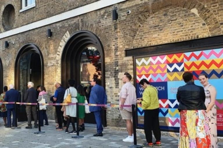 An image of people queuing at Woolwich Works