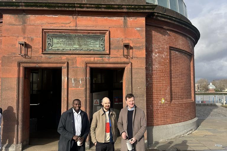 Councillor Anthony Okereke, Councillor Calum O'Byrne Mulligan and Deputy Mayor of London Seb Dance in front of the Greenwich Foot Tunnel.