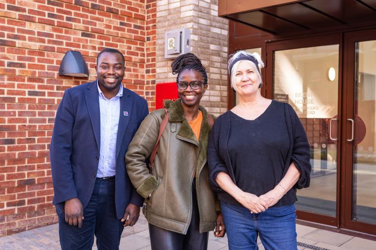 A photo of Leader Cllr Anthony Okereke and Cabinet Member Cllr Pat Slattery with a resident who came to view new council homes at Kidbrooke Park Road South