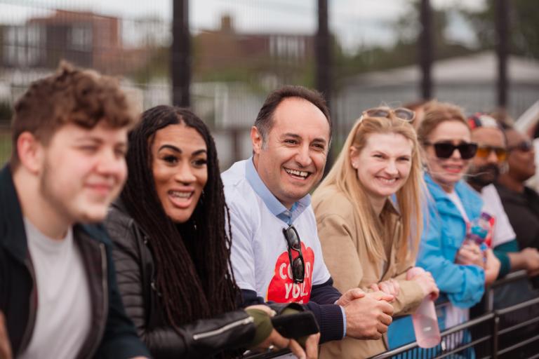 Staff supporting players at Foster Care Fortnight football match