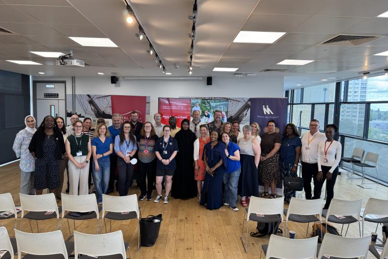 Businesses and community organisations smiling to camera at Match My Project pitching event