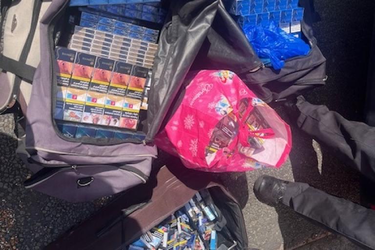 Big bags of confiscated tobacco and vapes.