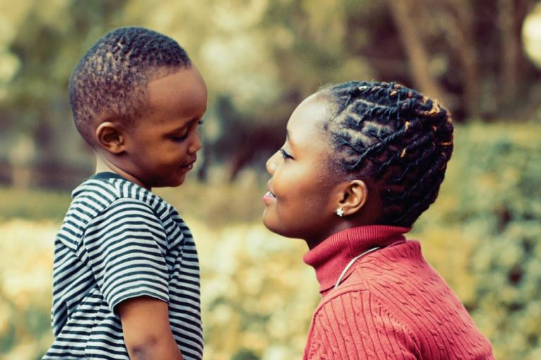 A foster parent speaking fondly to her son.