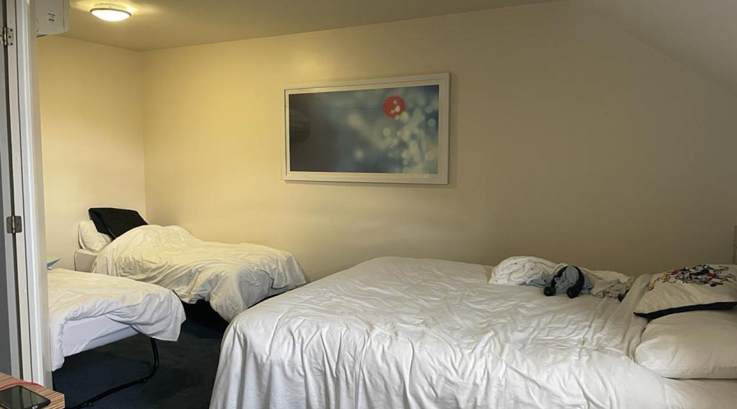 two empty beds in a room