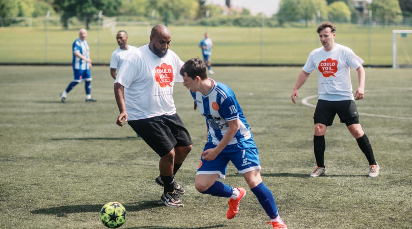 Cllr Adel Khaireh playing football.