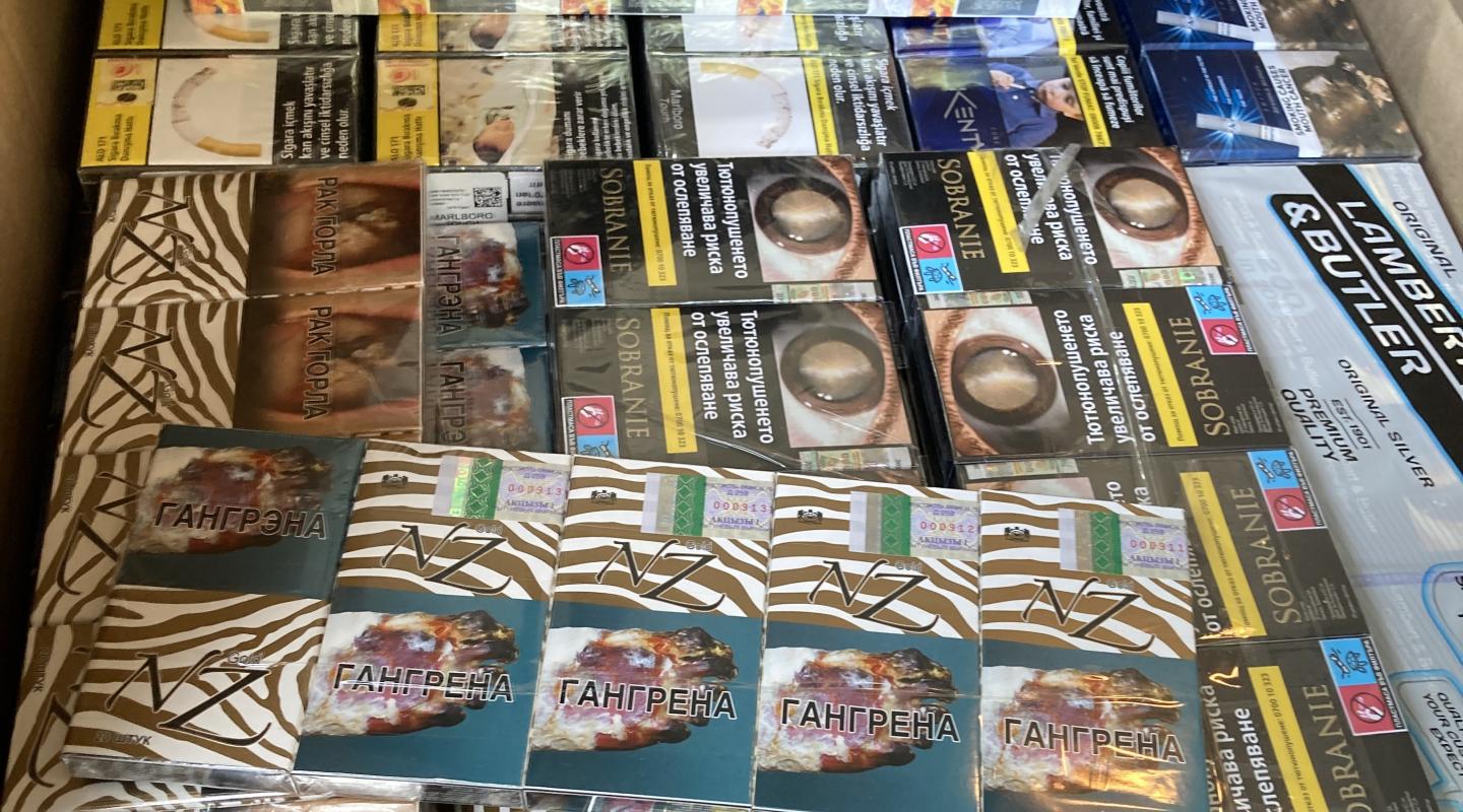 A box full of packets of seized cigarettes 