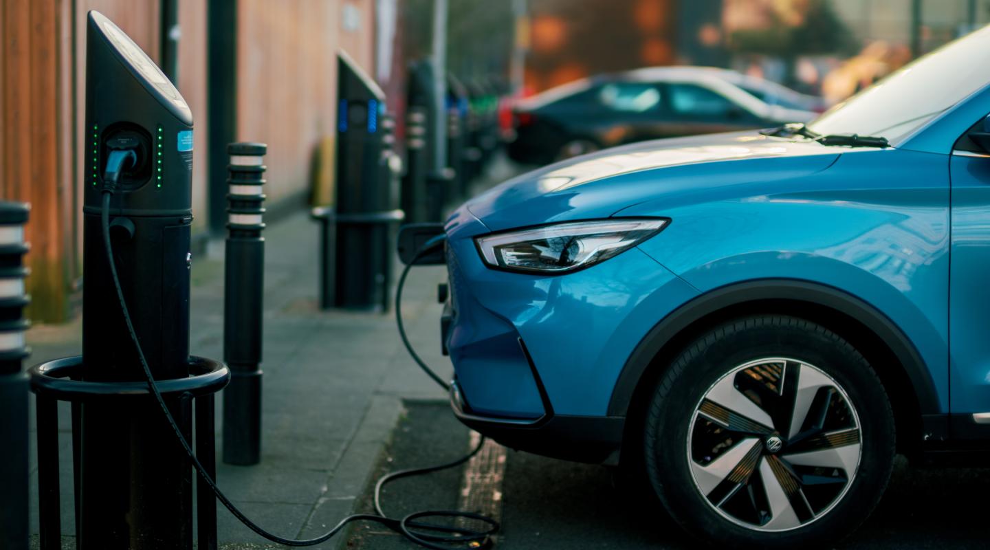 An image of an electric vehicle being charged