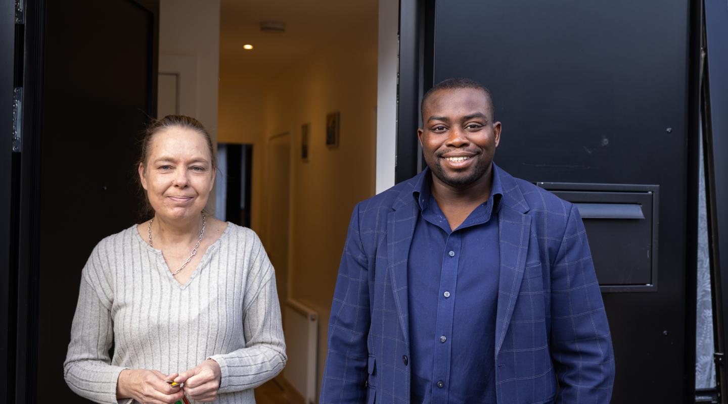 Councillor Anthony Okereke stood with resident Lisa in Tuskar Street council homes