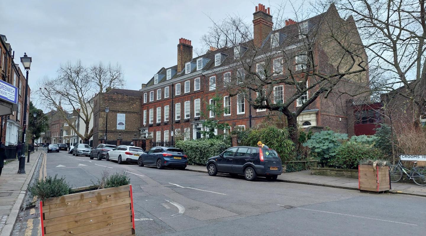 street view of parked cars on road 